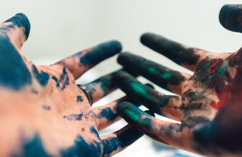hands with paint