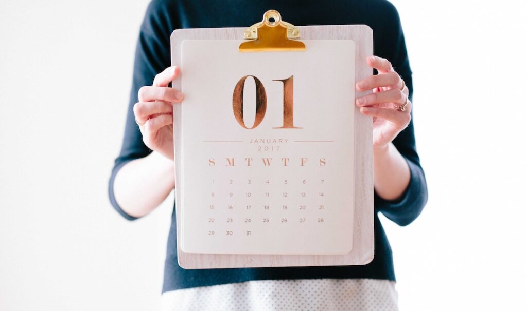 person holding calendar
