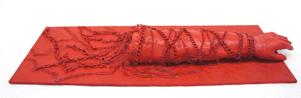 cast of arm in chains sculpture