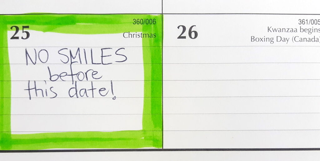 calendar with "no smiling" written on it