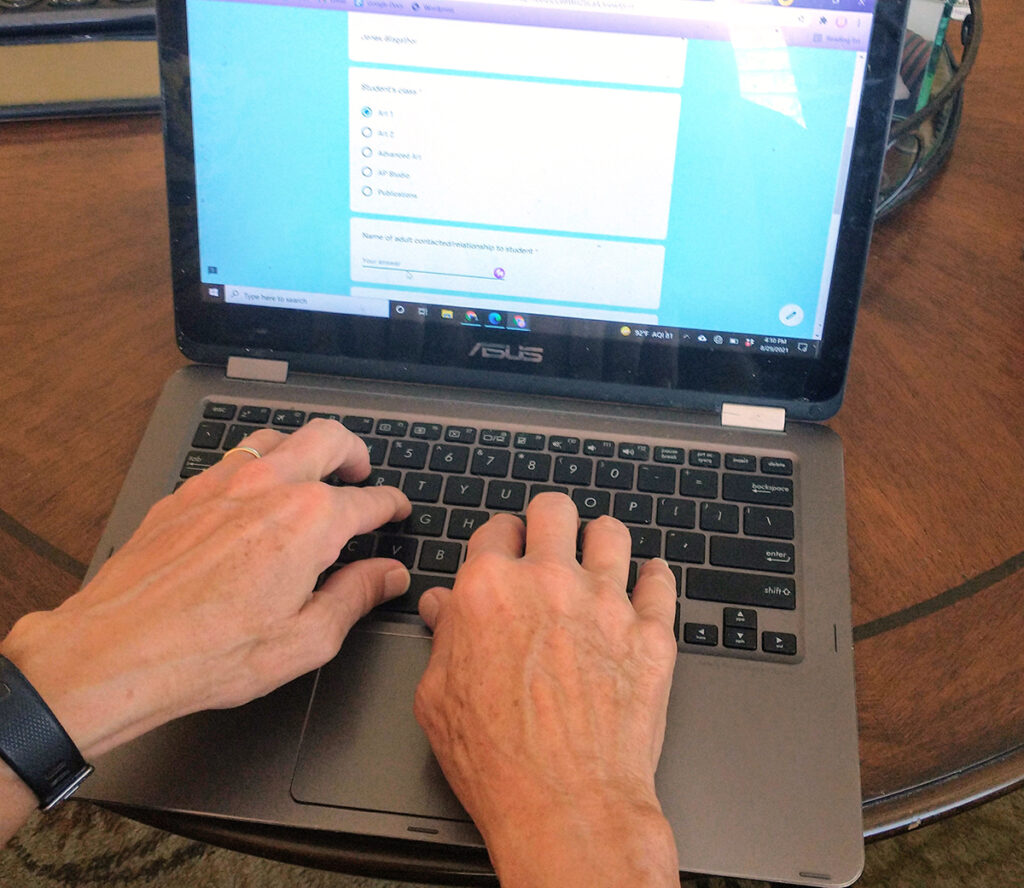 filling out a survey on a laptop
