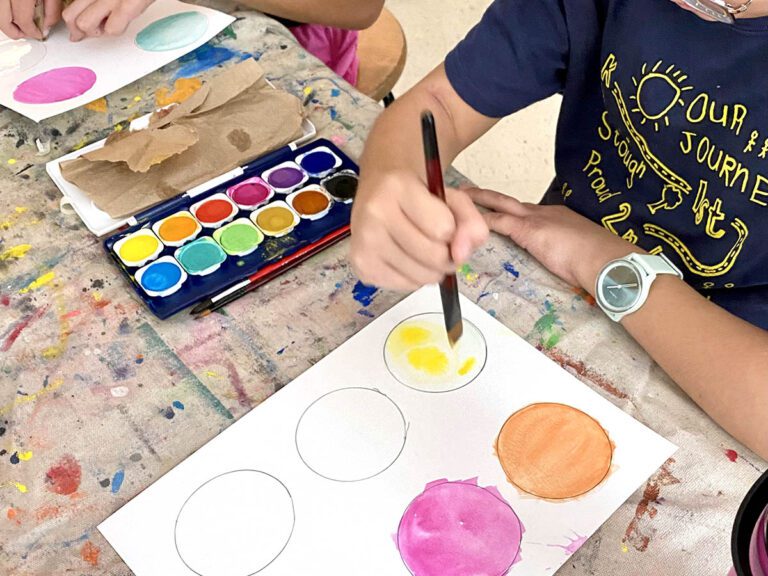 student with watercolors