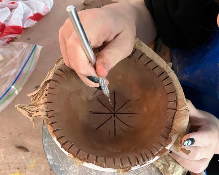 student scoring clay