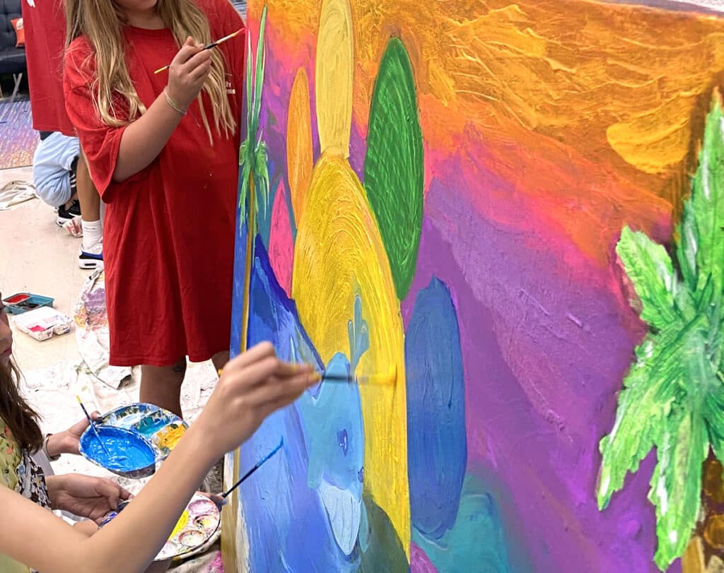 students painting