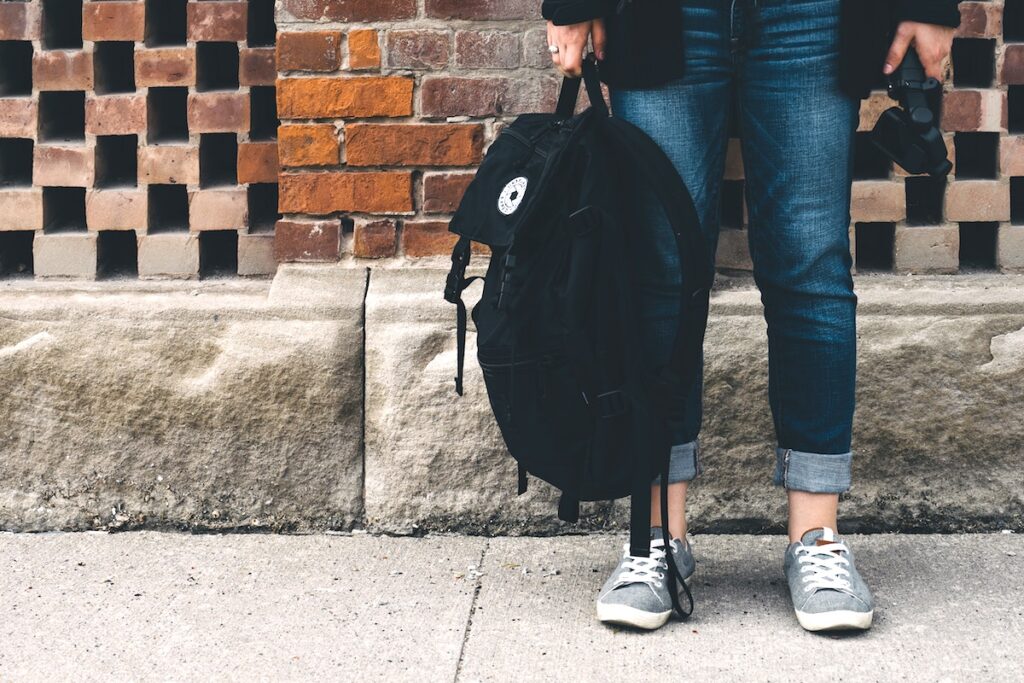 student with backpack
