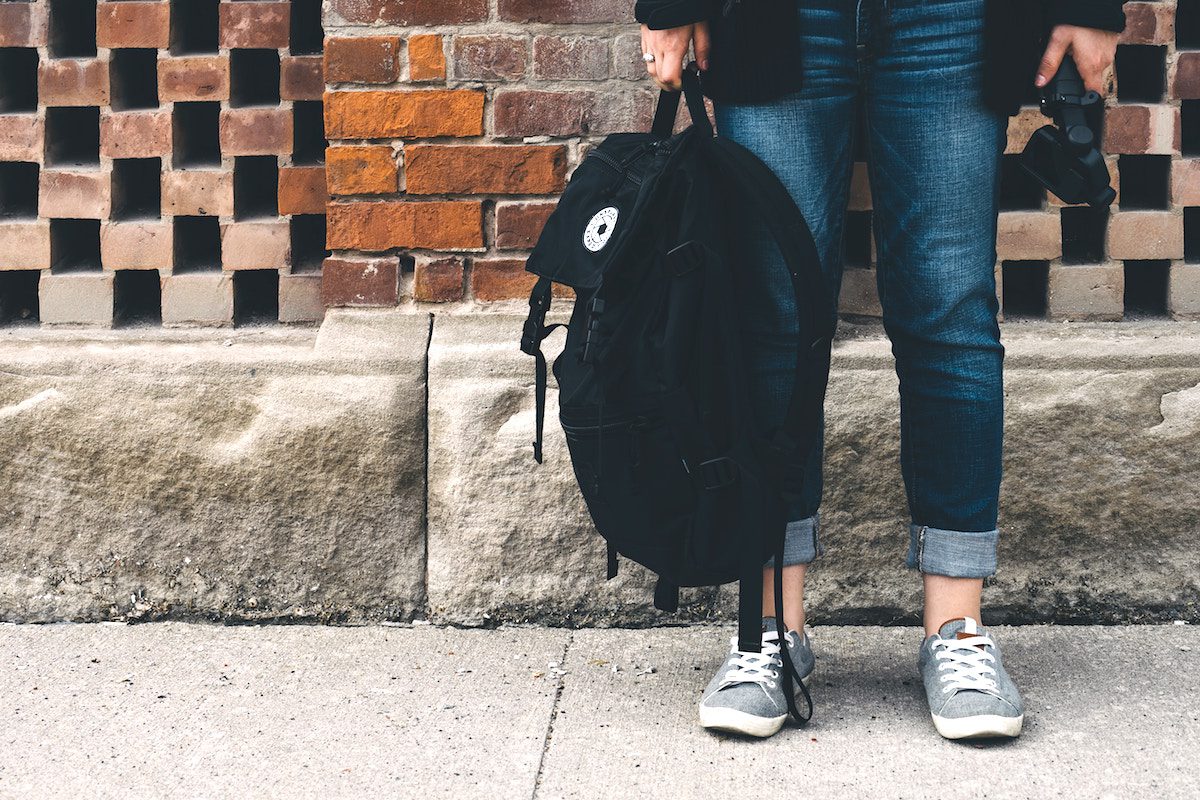 student with backpack