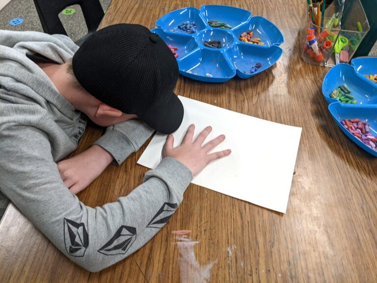 student with head down