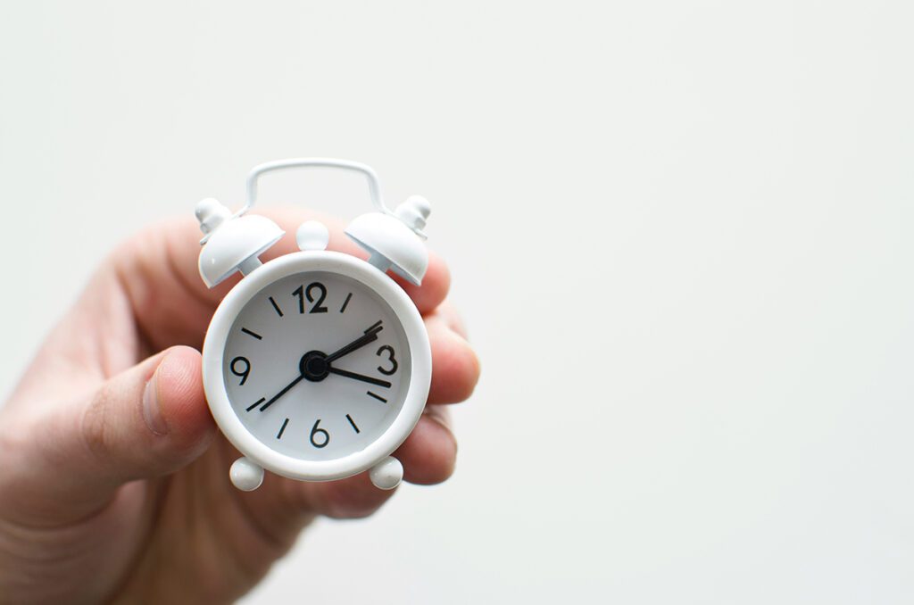 hand holding clock